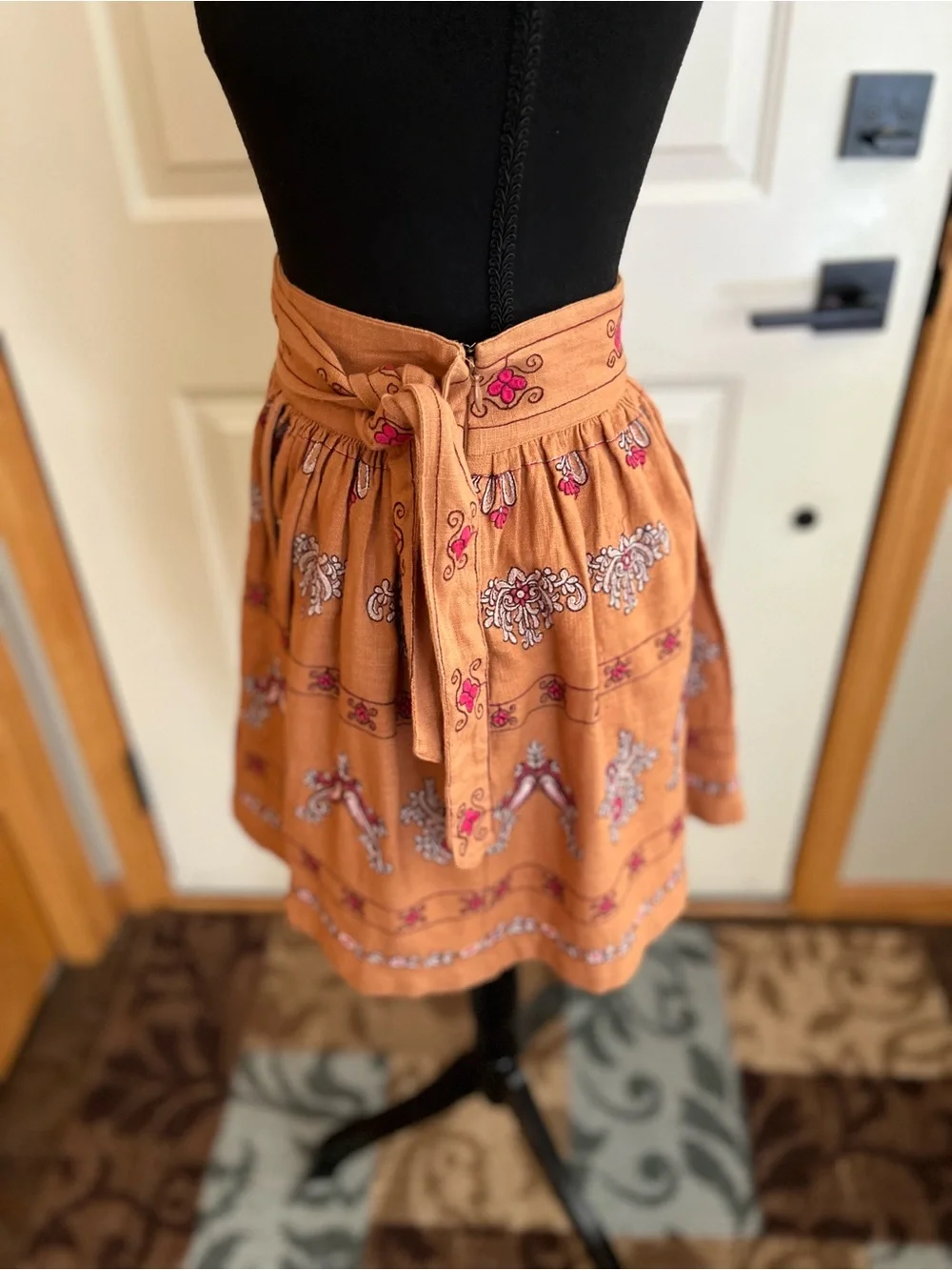 Anthropologie Meghan terracotta embroidered folkloric mini wrap skirt. Size 0